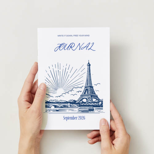 Mindful Journal September 2026 — A5-Cover mit blauer Eiffelturm-Illustration, daneben orangefarbene Mohnblumen